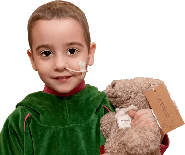 Sick Child Smiling with Teddy Bear